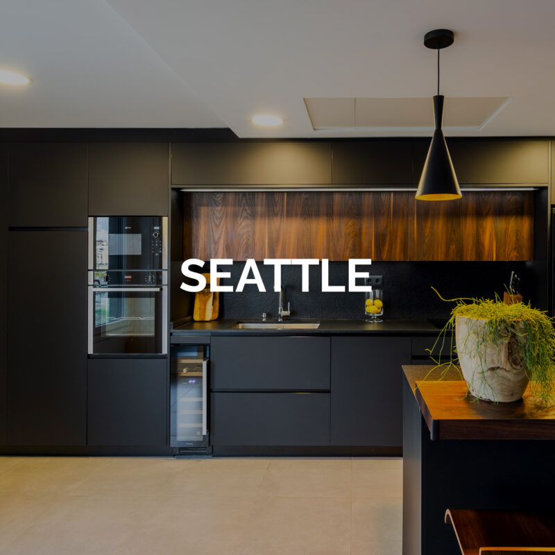 Cocina con península negra y encimera de madera - Cocina Seattle de Coeco