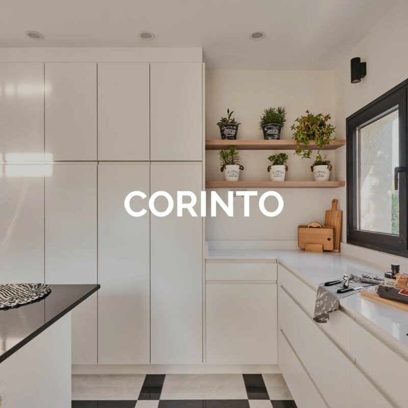 Cocina con isla blanca y encimera negra